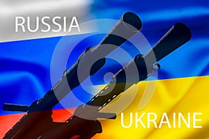 Military conflict between Russia and Ukraine, A gun against the background of two state flags of the warring states