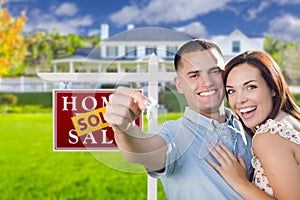 Military Couple In Front of Home, House Keys and Sign