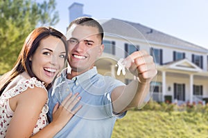 Military Couple with House Keys In Front of New Home