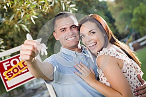 Military Couple with House Keys and Sold Real Esta