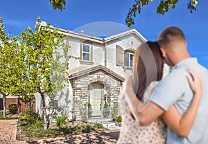 Military Couple Looking at Nice New House