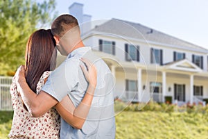 Military Couple Looking at Nice New House