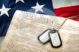 Military dog tags, the US Constitution and the American flag