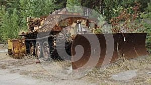 Military engineering bulldozer vehicle used during liquidation of aftermath of the chernobyl disaster in Ukraine. Rusted