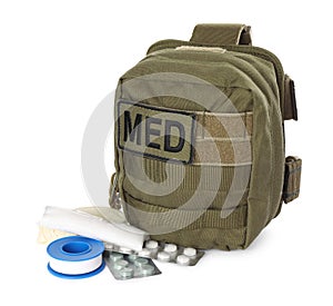 Military first aid kit with items isolated on white