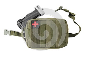 Military first aid kit and tourniquet on white background, top view