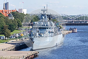 Military frigate docked