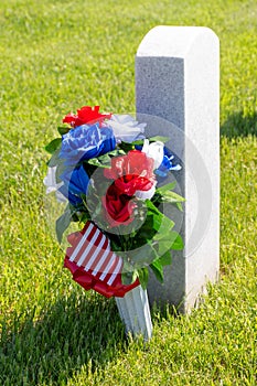 Military gravestone with American flag