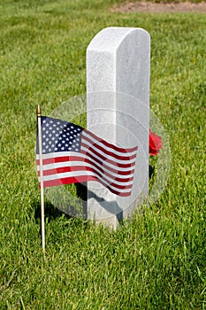 Military gravestone with American flag