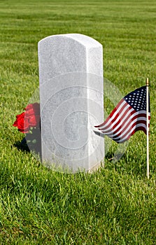 Military gravestone with American flag