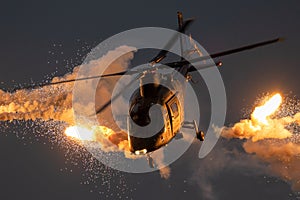 Military helicopter firing flares