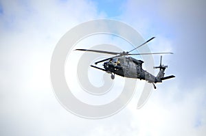 Military helicopter on blue sky