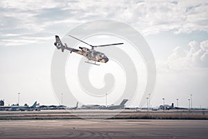 Military helicopter performing exercise at low altitude