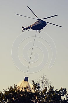 Military helicopter putting out forest fire in Istria Croatia