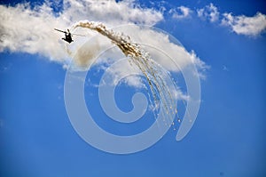 Military helicopter releasing flares photo