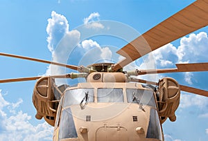 Military helicopter rotor with blue sky background