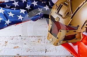 Military helmets and American flag on Veterans or Memorial day