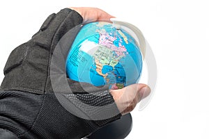 Military hold globe in hand