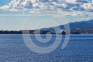 Military Italian warship leaving the harbor. Messina. Sicily. Italy