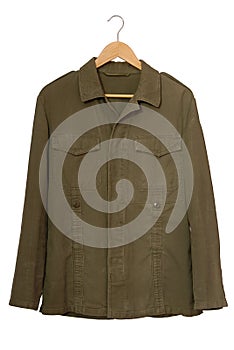 A military jacket is on clothes-hanger.
