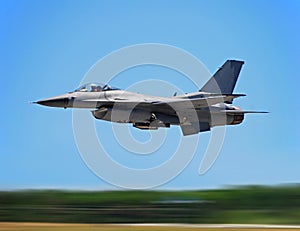 Military jet fighter in flight