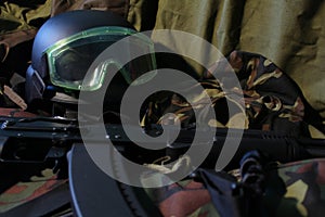 Military machine gun, helmet and goggles