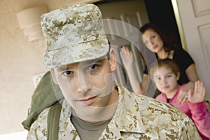 Military Man Leaving House