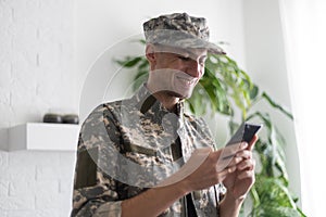 military man with phone, cyber police, information war