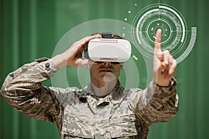 Military man in VR headset touching interface