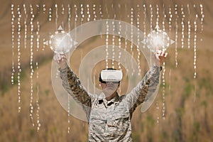 Military man in VR headset touching interfaces against field background with interfaces