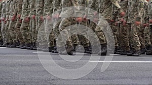 Military marching in the parade. Pixel uniform. Soldiers legs. War background. Boots forces and infantry. The men