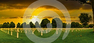 Military memorial crosses in sunset at Netherlands American Cemetery and Memorial Margraten