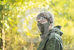 Military men with automatic weapons getting ready to play airsoft