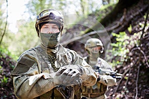 Military men in helmet and camouflage photo