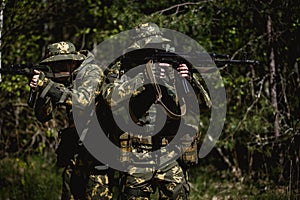 Military men with submachine gun