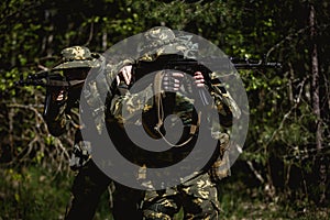 Military men with submachine gun