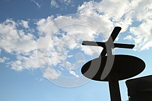 military mobile radar antenna against a blue sky