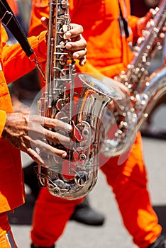 Military musicians from the fire department are seen playing wind instruments during the Santa Luzia festival procession in the