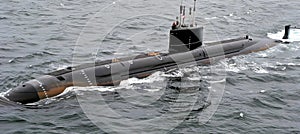 Military nuclear submarine launching torpedo missile in expansive oceanic waters