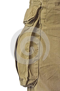 Military olive green army style cotton twill cargo pants storage pocket isolated macro closeup, large detailed camouflage trousers