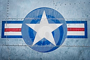 Military plane with star and stripe sign.