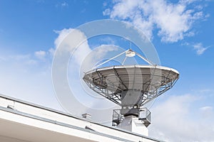 Military radiolocator station with parabolic radar antenna dish