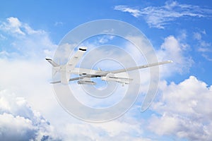 military RC military drone flies against the backdrop of blue peaceful sky with white clouds