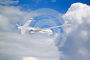 military RC military drone flies against the backdrop of blue peaceful sky with white clouds