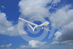 military RC military drone flies flies against backdrop of beautiful clouds on blue sky background. Elements of this image