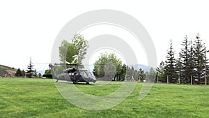Military rescue helicopter ready for the taking off at the countryside