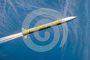 A military rocket flies against the blue sky