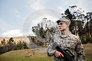 Military soldier guarding with a rifle