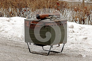 military soldier hunting metal stationary kitchen for preparing outdoor meals.