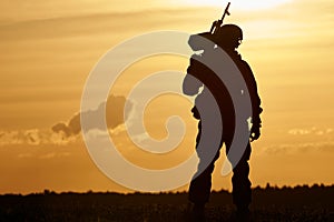 Military soldier silhouette with machine gun